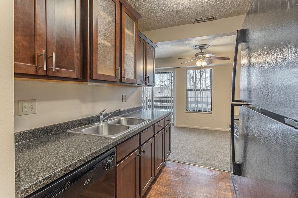 a kitchen with a sink and a refrigerator