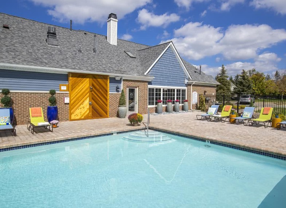 a swimming pool in front of a house