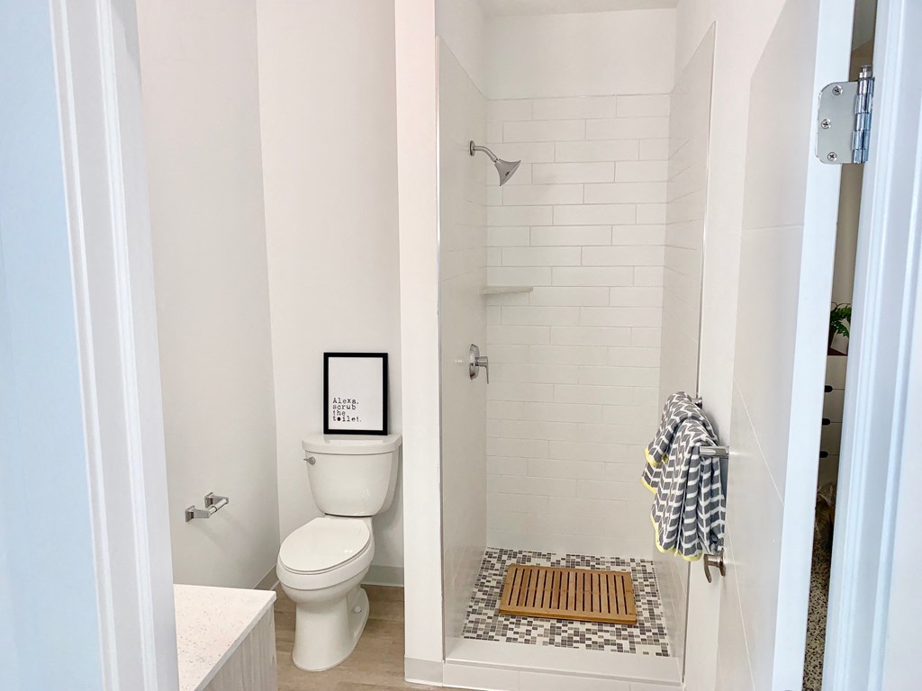 a small bathroom with a toilet and a shower