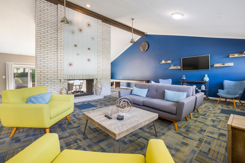 Living room with couch and table in clubhouse at Foote Hills Apartments - Grand Rapids, MI Apartments, Grand Rapids