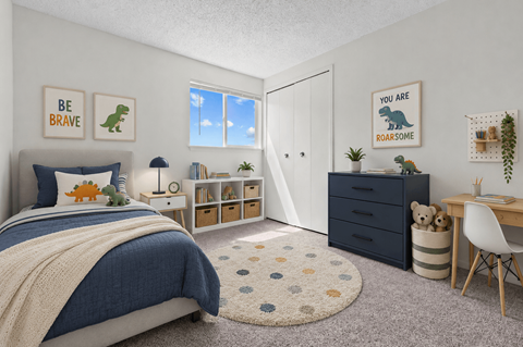 A bedroom with a bed, desk, and a rug with a dinosaur print.
