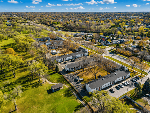 A bird's eye view of a residential area with houses and trees.