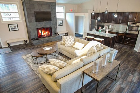 a living room with a fireplace and a couch
