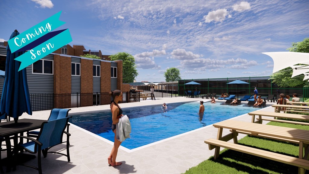 A woman is standing by a pool with a banner that says "Coming Soon" in the background.