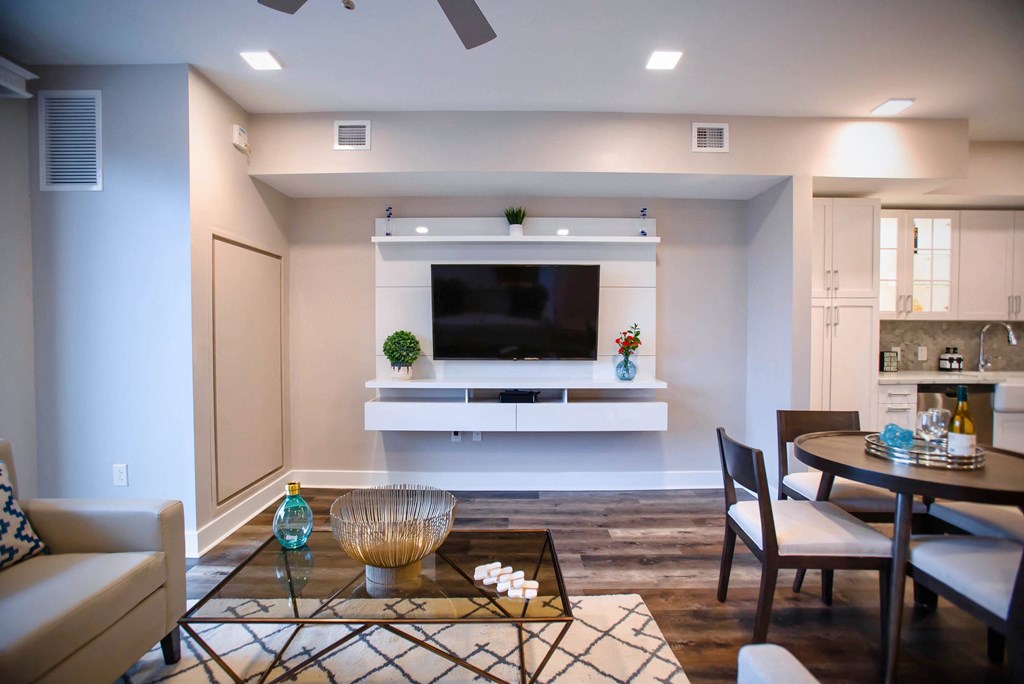 a living room with a tv and a table