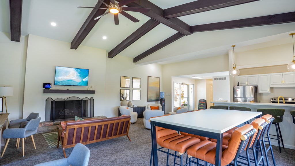 A modern living room with a fireplace and a television.