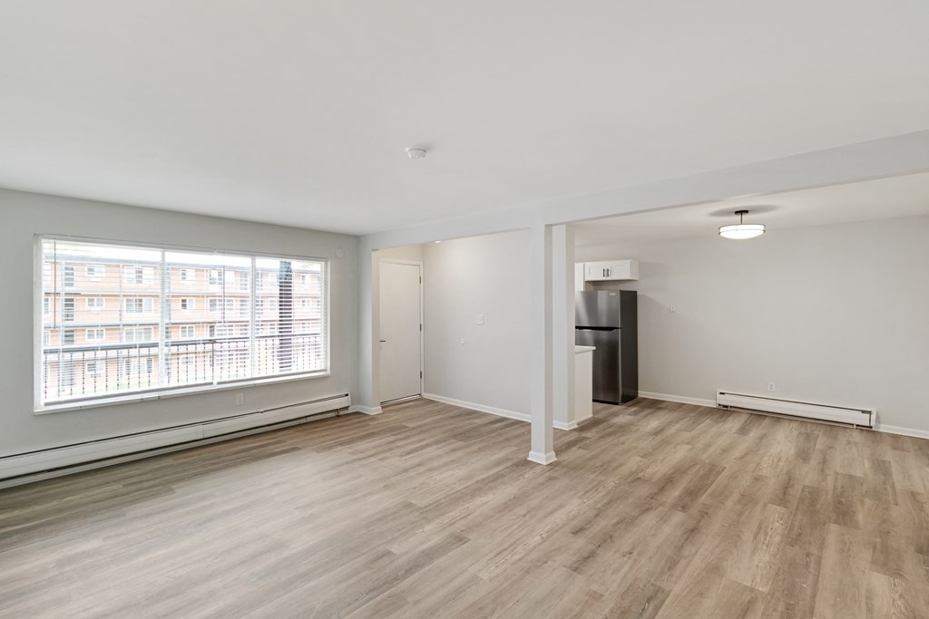 A room with a window and a door.