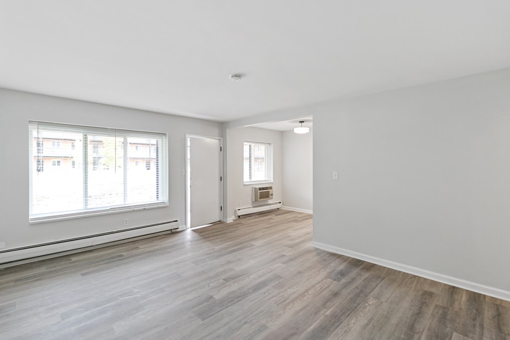 A room with a window and a door.