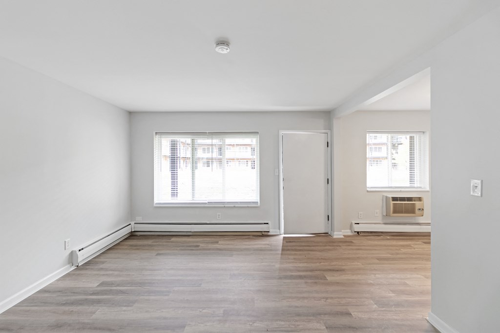 A room with a window and a door.