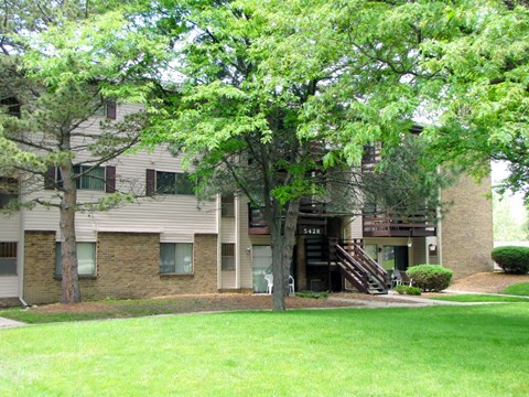 our apartments have a large green lawn and trees