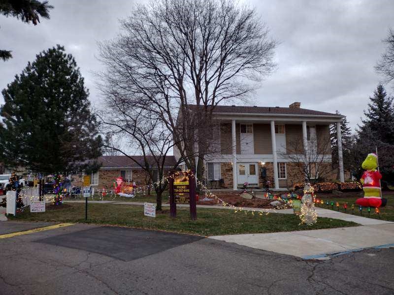 a house with christmas decorations on the lawn