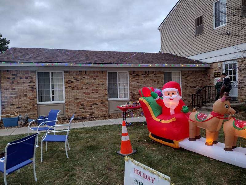 a house with a christmas decoration in the yard