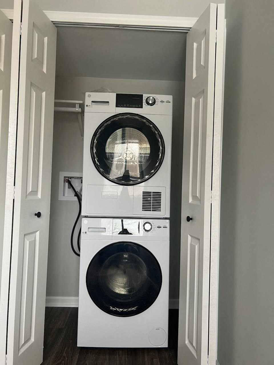 a washing machine and dryer in a small closet