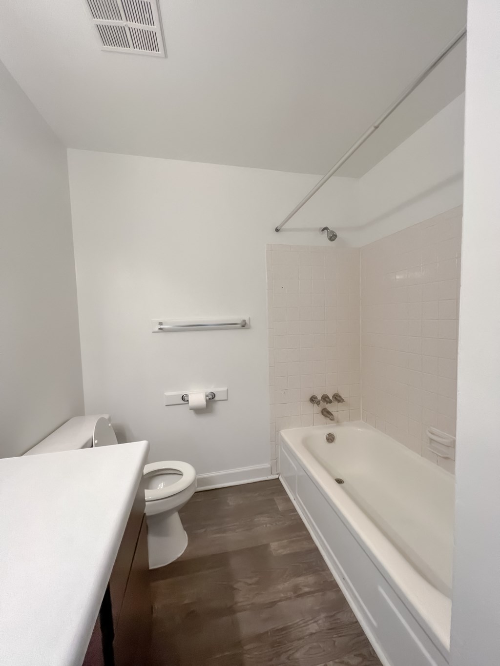 a bathroom with a toilet sink and bathtub