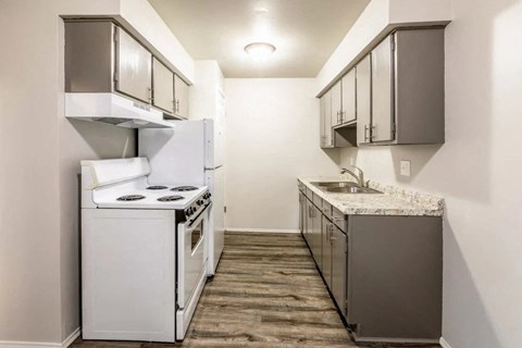 a small kitchen with a stove and a sink