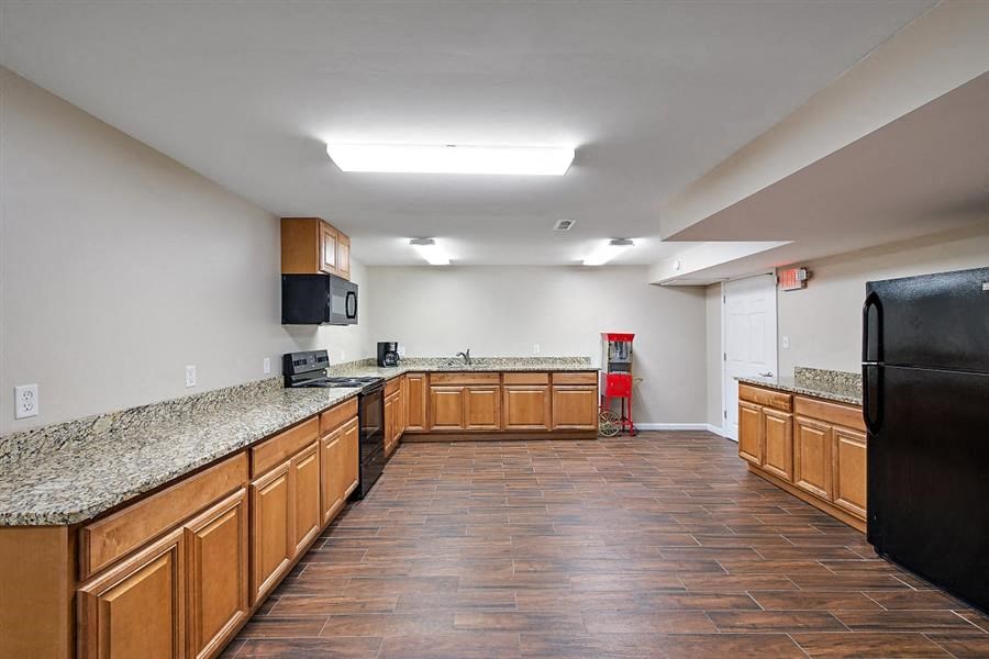 a kitchen with a counter top and a refrigerator