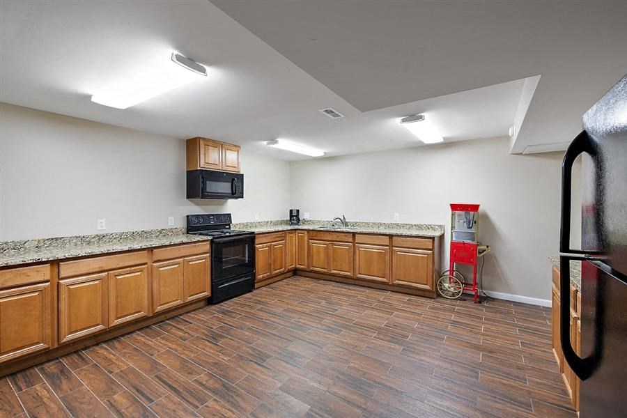 a kitchen with a counter top and a refrigerator
