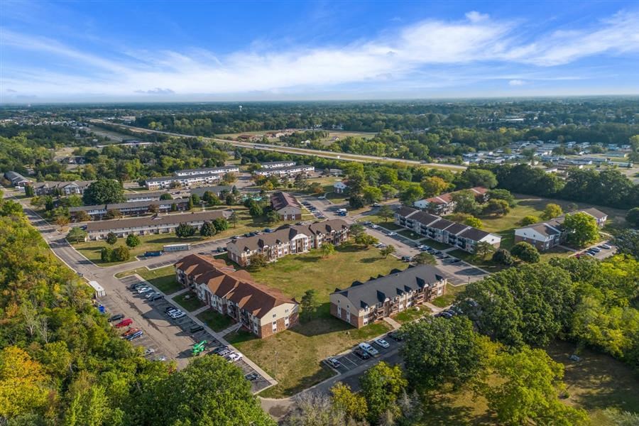an aerial view of a neighborhood with houses and trees