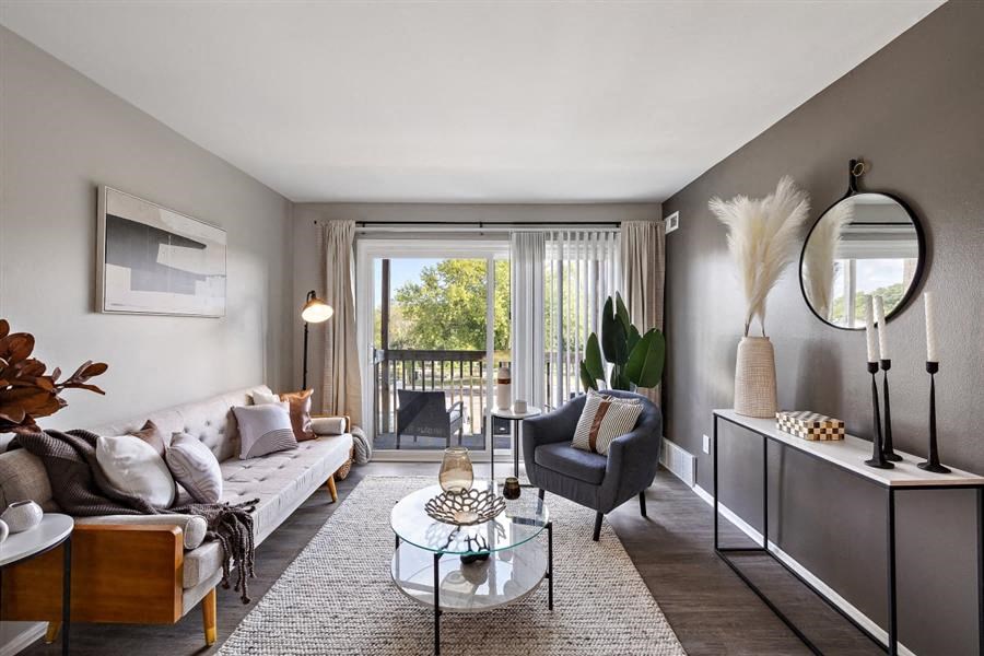 a living room with a couch and a sliding glass door