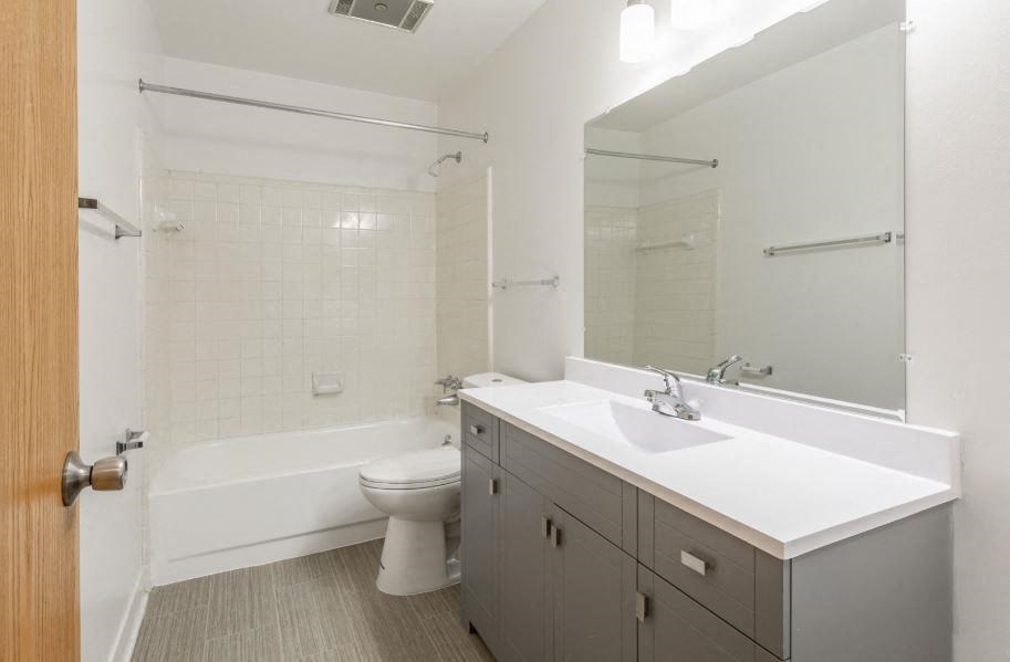 a bathroom with a sink toilet and bathtub