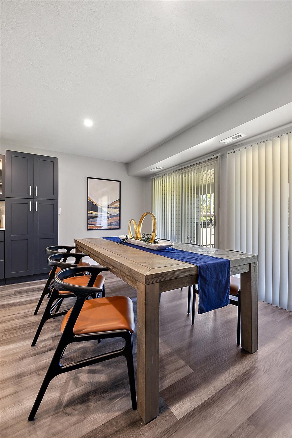 the residence has a large dining room with a table and chairs at Sunnymede Apartments - Troy, MI, Troy, Michigan