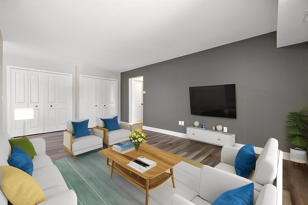 a rendering of a living room with couches and a table at Sunnymede Apartments - Troy, MI, Troy, Michigan