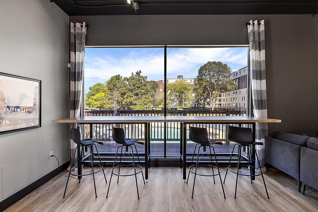 a rendering of a balcony with a table and chairs at Troy Place Apartments - Troy, MI, Troy, Michigan
