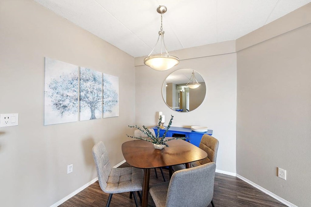 a dining room with a table and chairs at Troy Place Apartments - Troy, MI, Troy