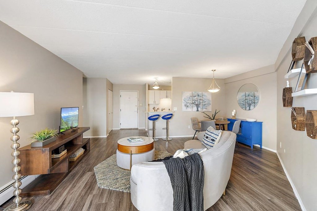 a living room with a couch at Troy Place Apartments - Troy, MI, Troy, 48084