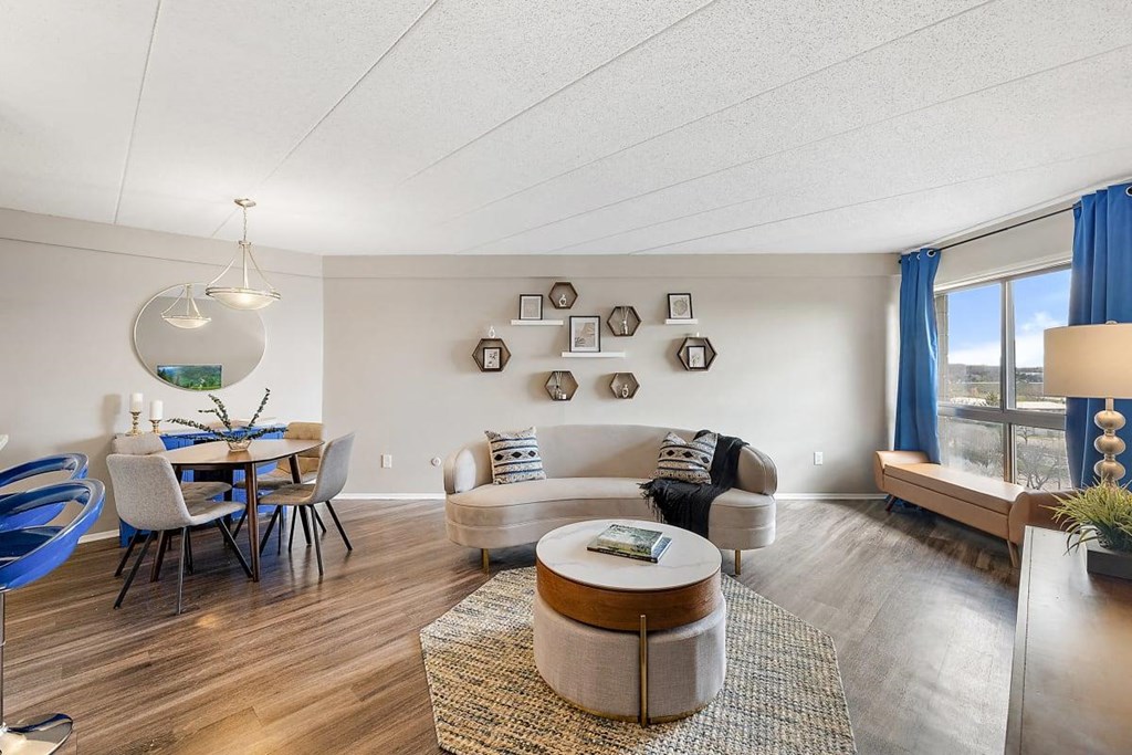 Living room couch, table at Troy Place Apartments - Troy, MI, Troy, Michigan