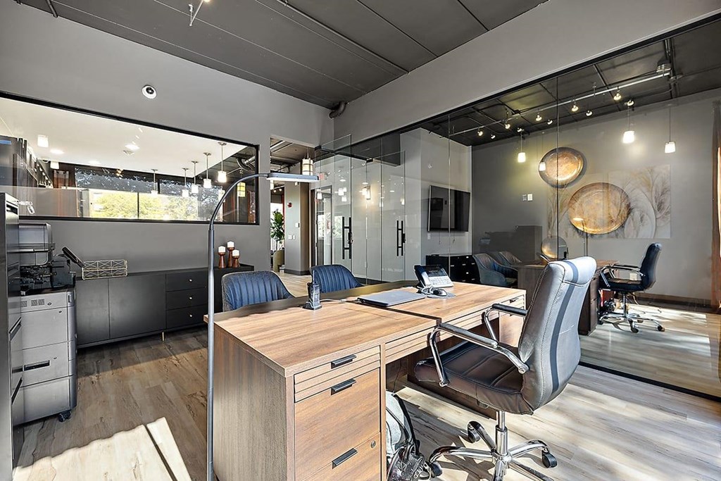 a modern office with a desk and chairs at Troy Place Apartments - Troy, MI, Troy, 48084