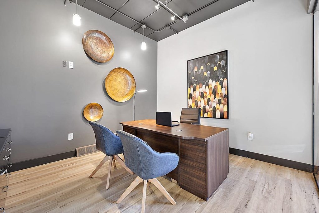 a conference room with a wooden desk and chairs at Troy Place Apartments - Troy, MI, Troy, Michigan