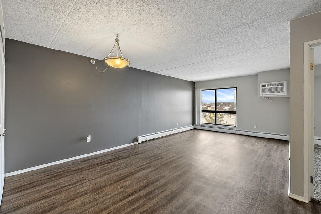 wood floors and a window at Troy Place Apartments - Troy, MI, Troy
