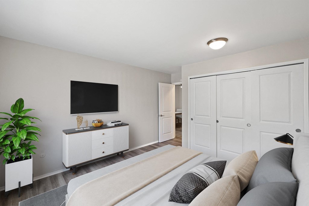 couch and a tv at Town & Country Apartments - Wixom, MI, Wixom, Michigan