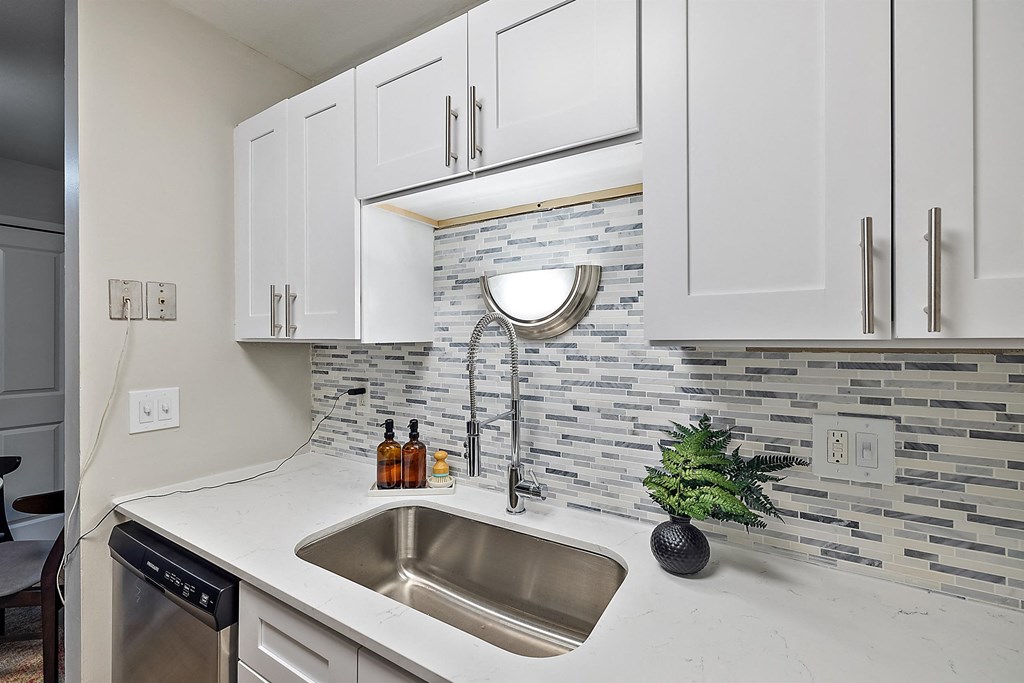 Kitchen with cabinets at Town & Country Apartments - Wixom, MI, Wixom, 48393