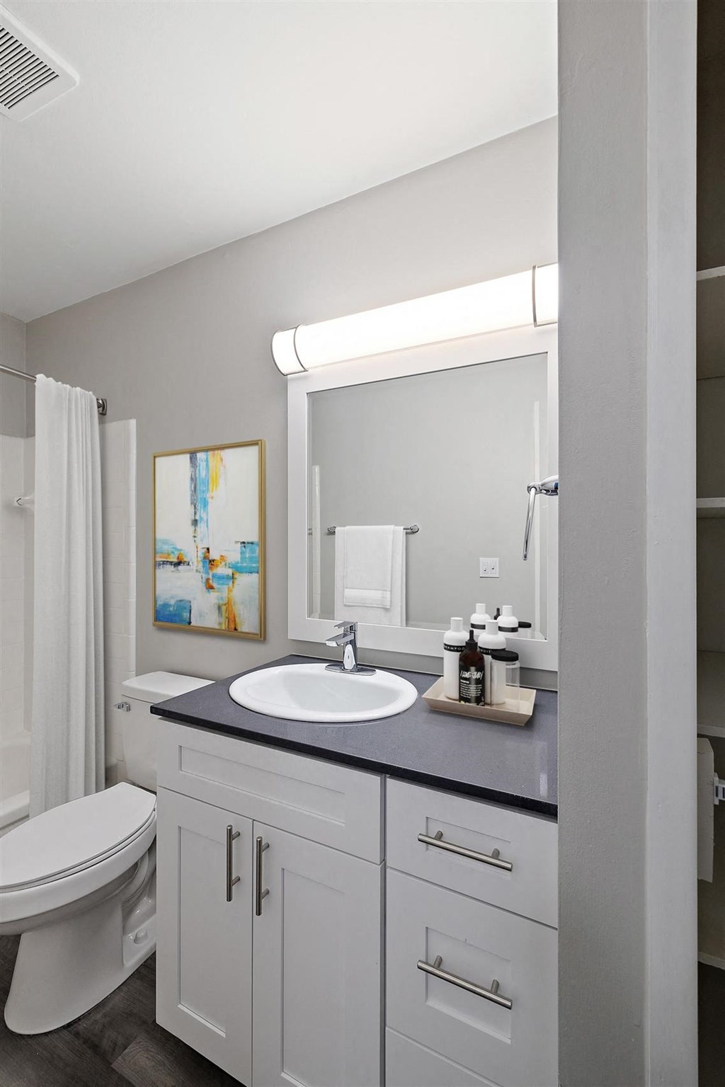 white bathroom with a sink at Town & Country Apartments - Wixom, MI, Wixom