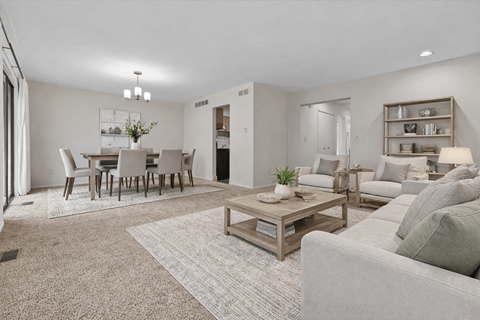 A living room with a grey couch and a coffee table.