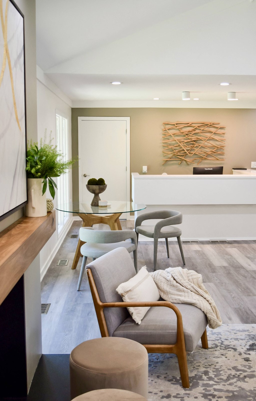 a living room with a couch and chairs and a table