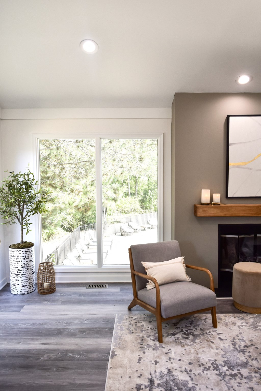 a living room with a chair and a window