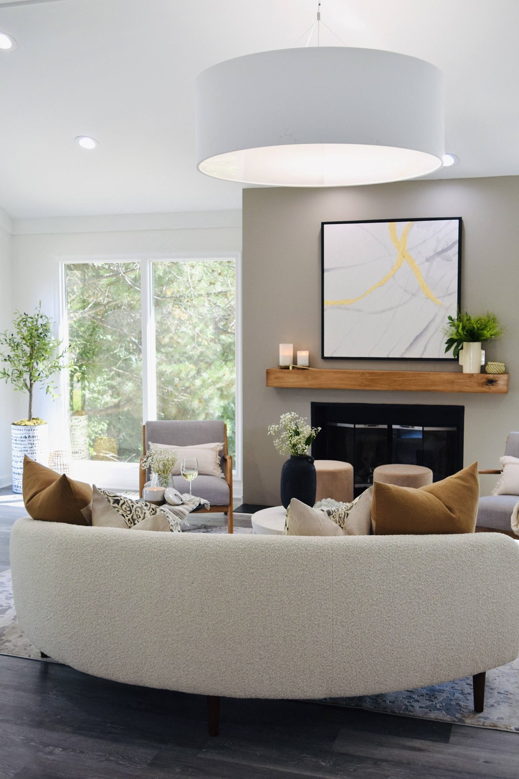 a living room with a white couch and a fireplace