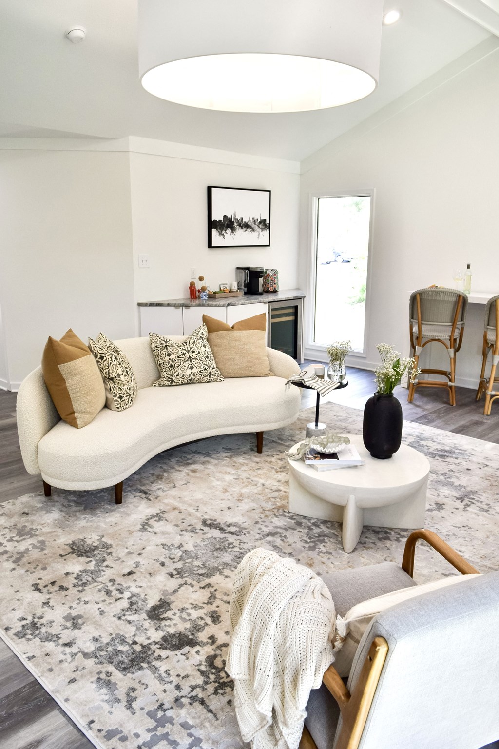 a living room with a white couch and a rug