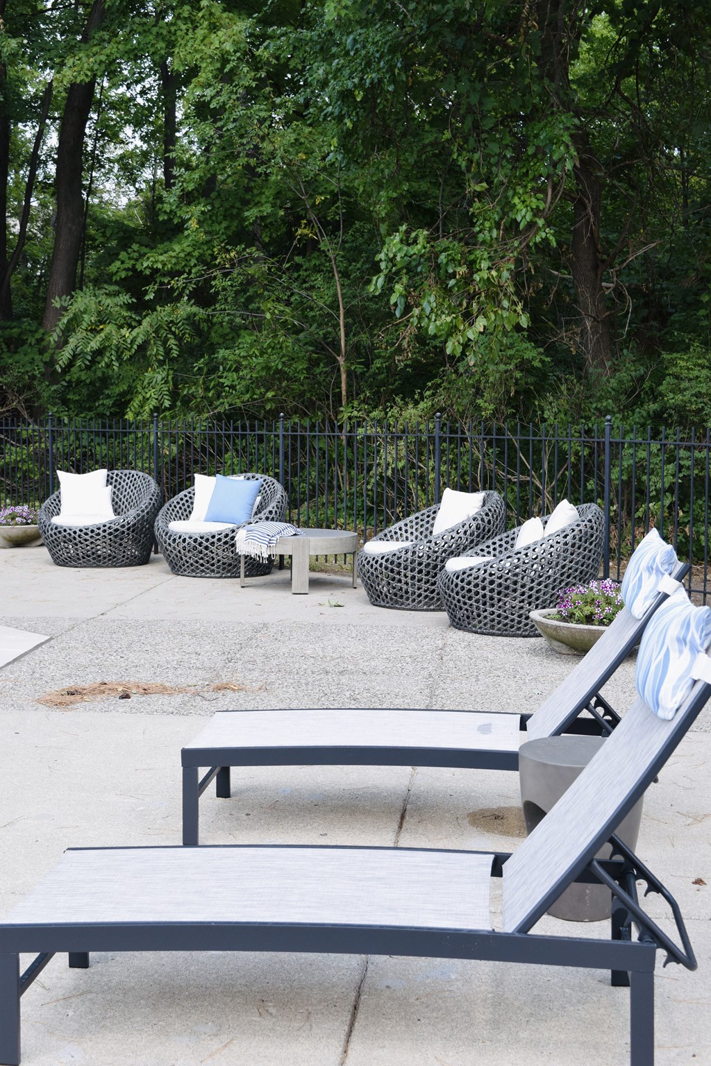 a seating area with couches and a table in a park