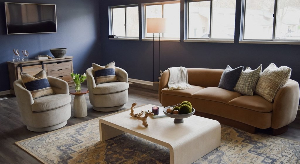 Living room decor with couch and table at Foote Hills Apartments - Grand Rapids, MI Apartments, Grand Rapids, 49546