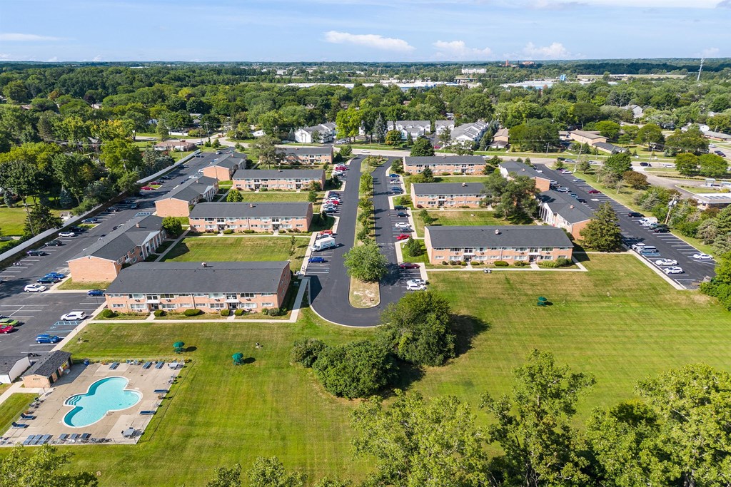 an aerial view of a neighborhood of houses and a parking lot