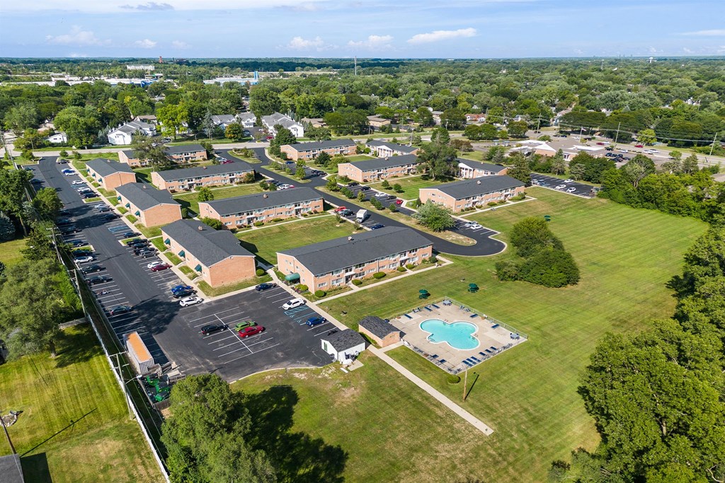 an aerial view of several buildings in a parking lot