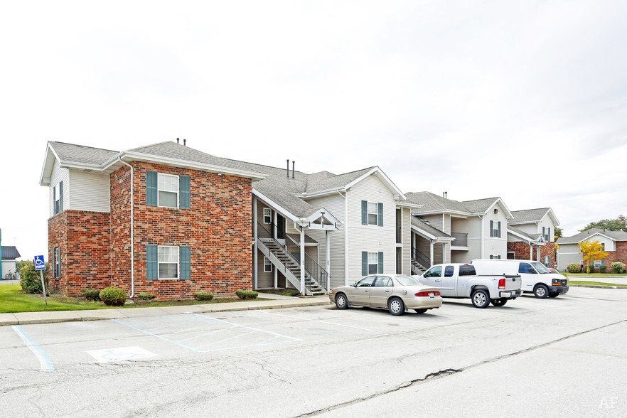 a parking lot in front of a row of houses