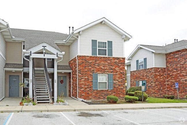 a house with a staircase in front of it