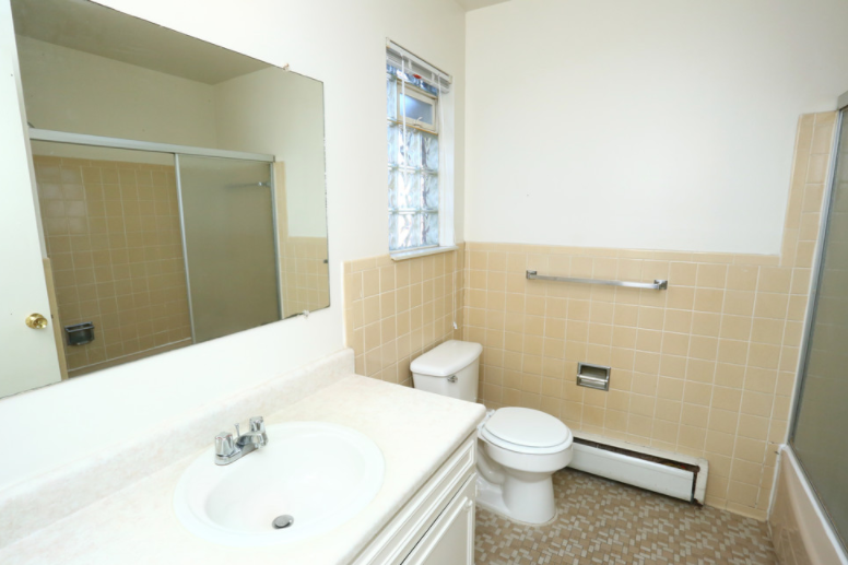a bathroom with a sink and a toilet and a mirror