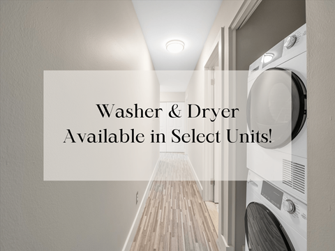 a laundry room with washer and dryer available in select units