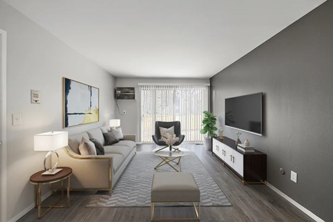 A modern living room with a grey sofa, a wooden side table, a grey rug, a wooden coffee table, a TV, and a plant.